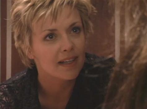 Amanda Tapping Breasts Scene in Stuck